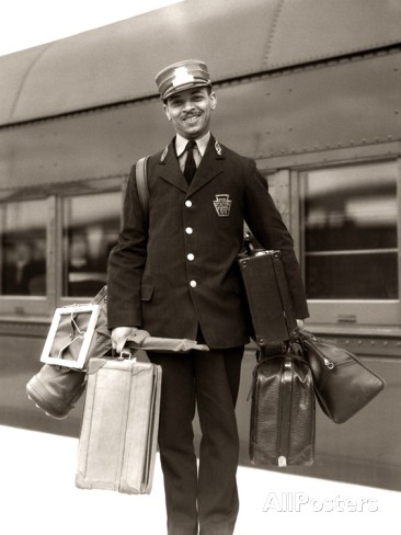 1930s-1940s-man-red-cap-porter-carrying-luggage-bags-suitcases-passenger-railroad-train