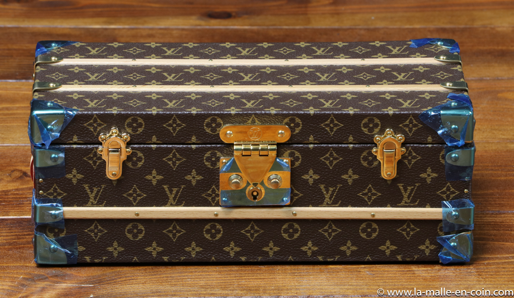 Louis VUITTON. Monogrammed paper flower trunk, bearing a…