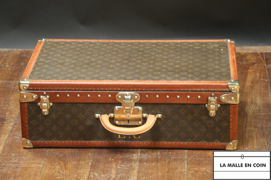 This suitcase from the luxury brand Louis Vuitton is in monogrammed canvas