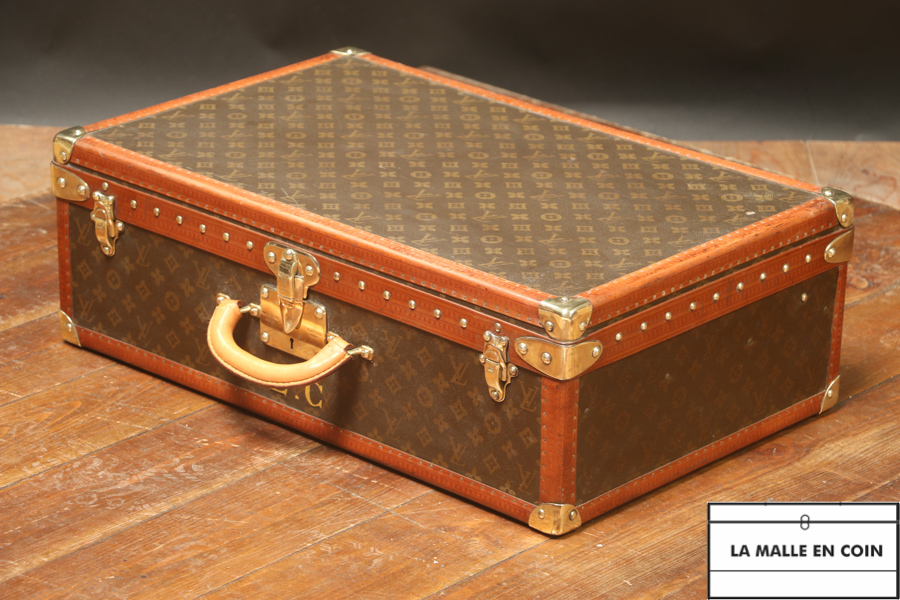 This suitcase from the luxury brand Louis Vuitton is in monogrammed canvas