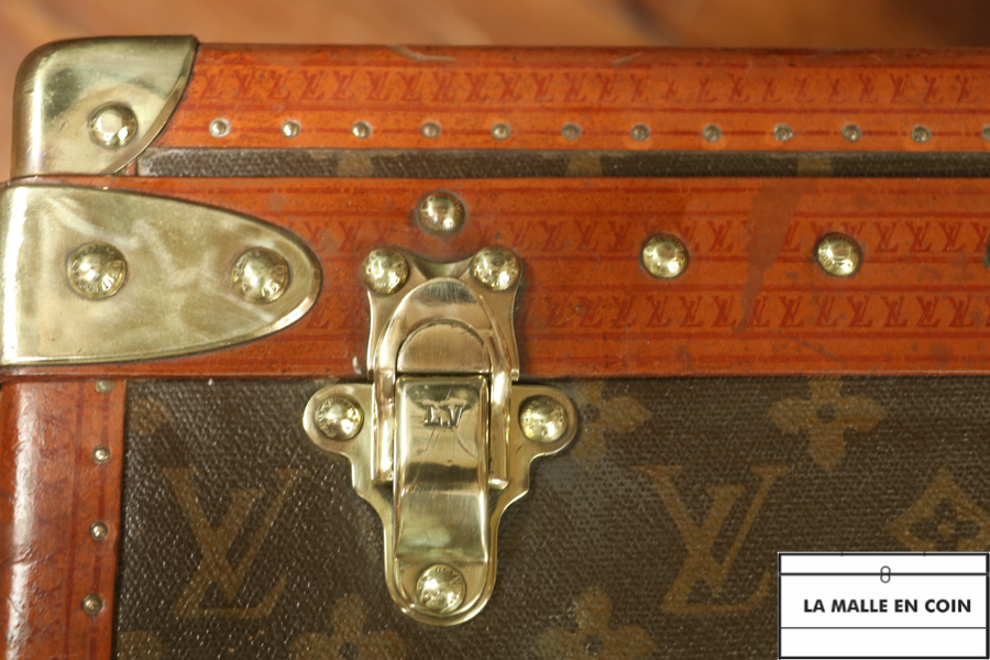 This suitcase from the luxury brand Louis Vuitton is in monogrammed canvas