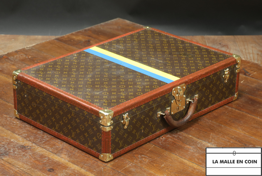 Suitcase of the Louis Vuitton brand with its stable bands