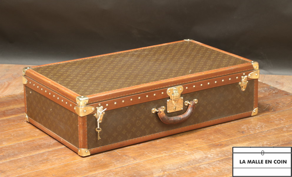 At Auction: Louis Vuitton - Alzer monogram suitcase, numbered