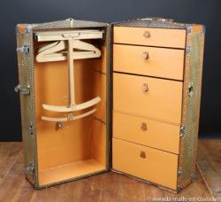 M monogrammed wardrobe trunk by Moynat.