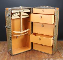 M monogrammed wardrobe trunk by Moynat.