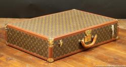 Louis Vuitton suitcase, with key 