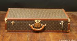 Louis Vuitton suitcase, with key 